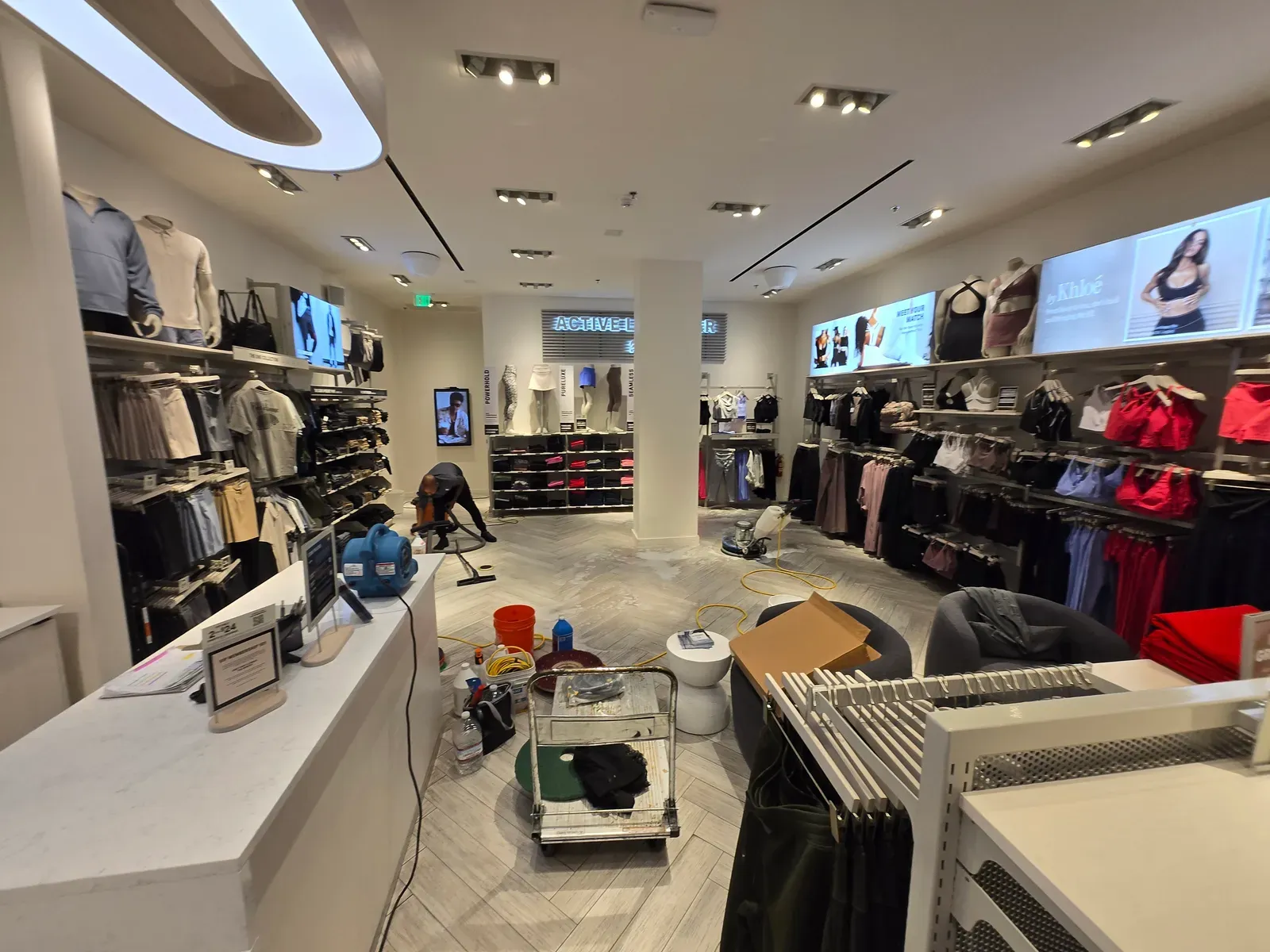 Floor cleaning and air movers set up inside a Las Vegas mall retail store during a commercial service