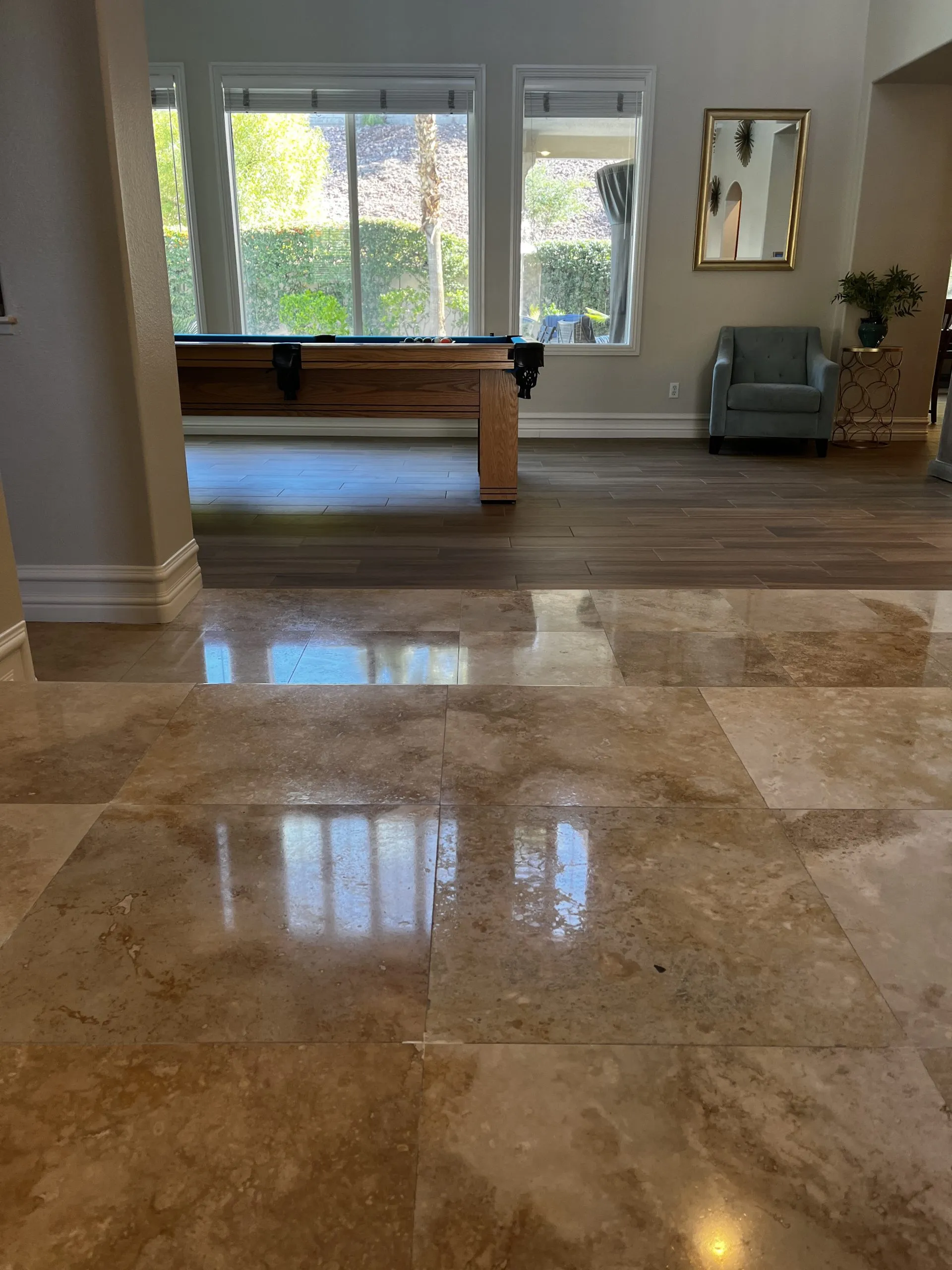 Polished travertine floor in a Las Vegas great room with open layout and large windows